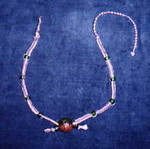 Natural and purple hemp with green glass beads and large center-piece bead (1) (Will get a better photo of this soon...)