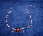 Natural and purple hemp with green glass beads and large center-piece bead (2) (Will get a better photo of this soon...)