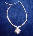 Natural-colored hemp with brown glass beads and carved bone center-piece (1) (Will get a better picture of this soon)