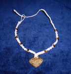 Natural-colored hemp with brown glass beads and carved bone center-piece (2) (Will get a better picture of this soon)